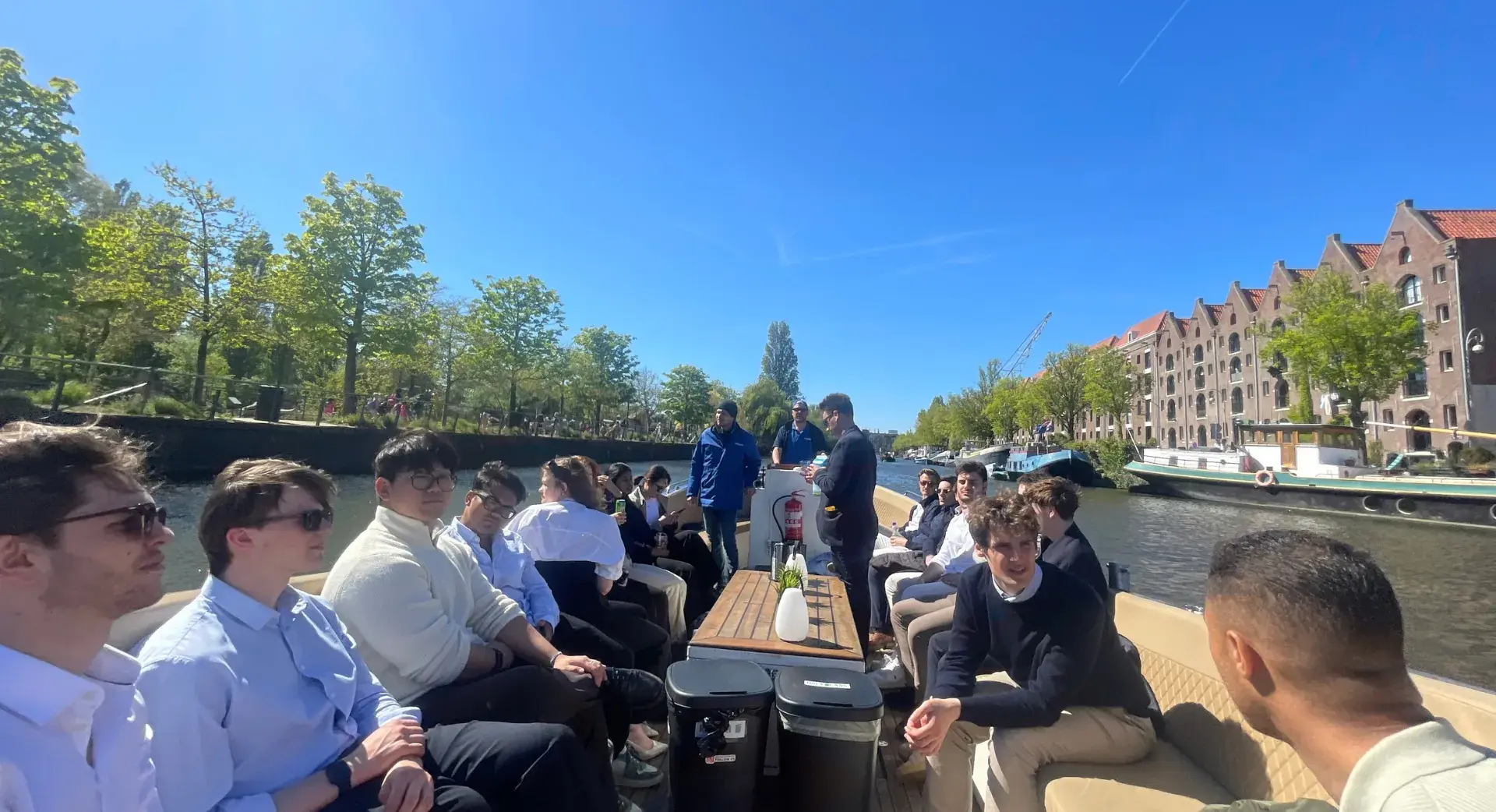 REA members on a canal boat in Amsterdam