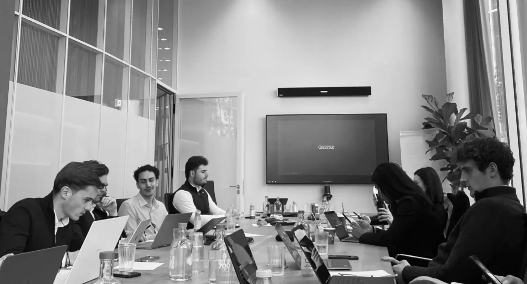Members working through a case around a boardroom table