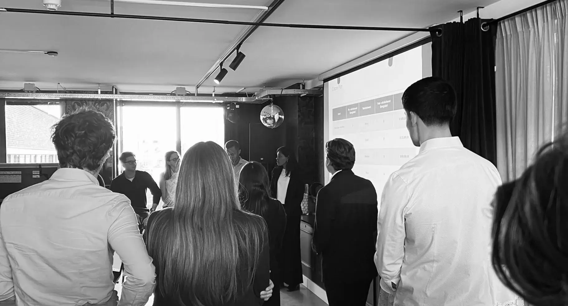 Members working through a case around a boardroom table