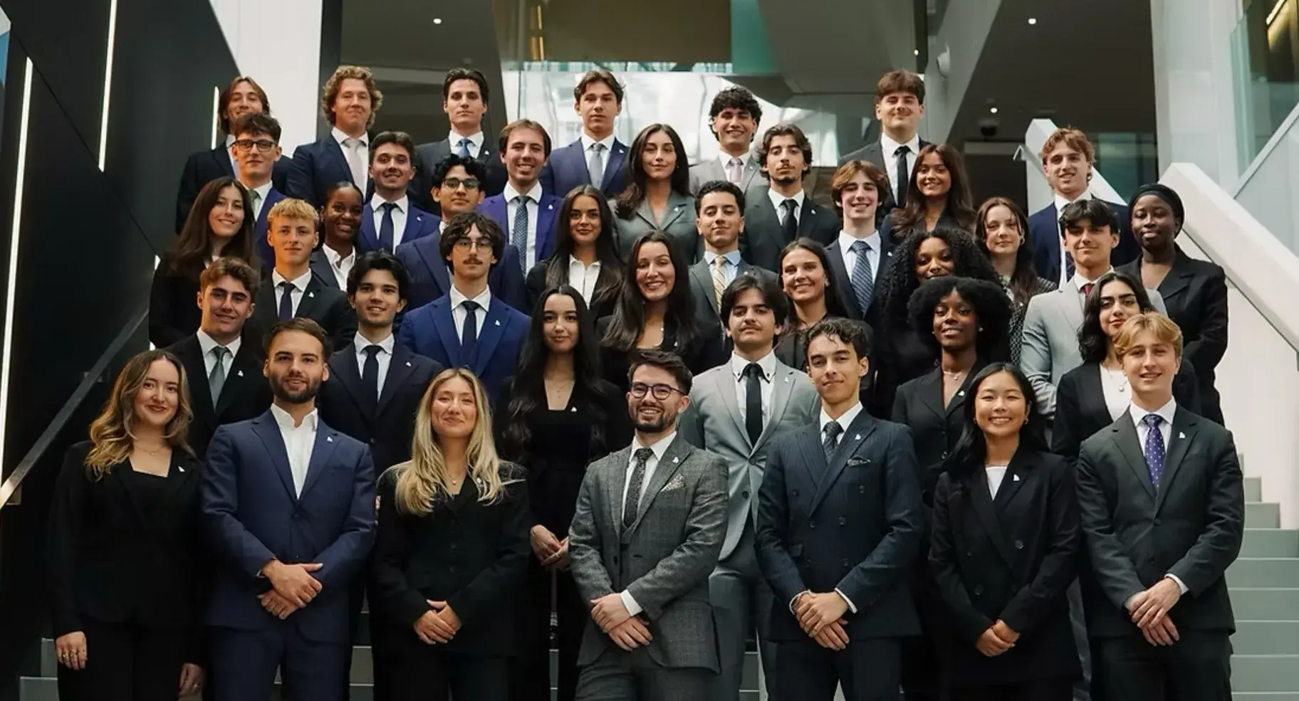 The ImmoHEC committee on the staircase at HEC Montréal