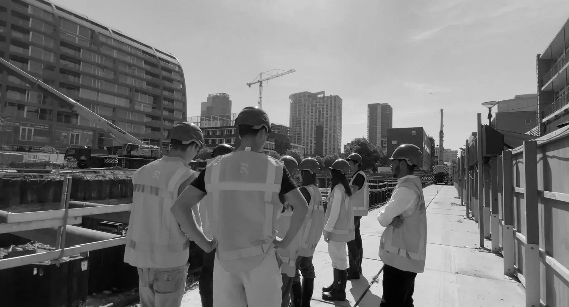 Members touring a project in high-visibility vests