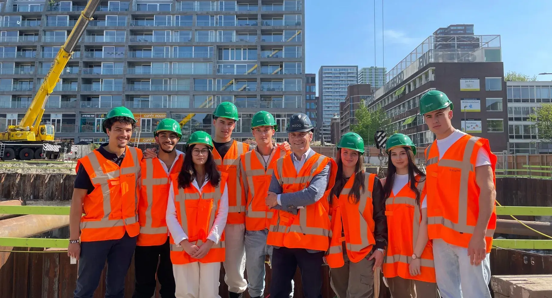 Members touring a project in high-visibility vests