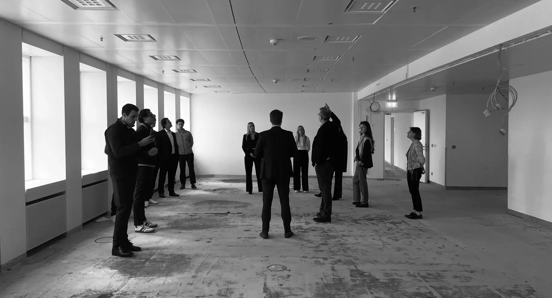 Members touring a project in high-visibility vests