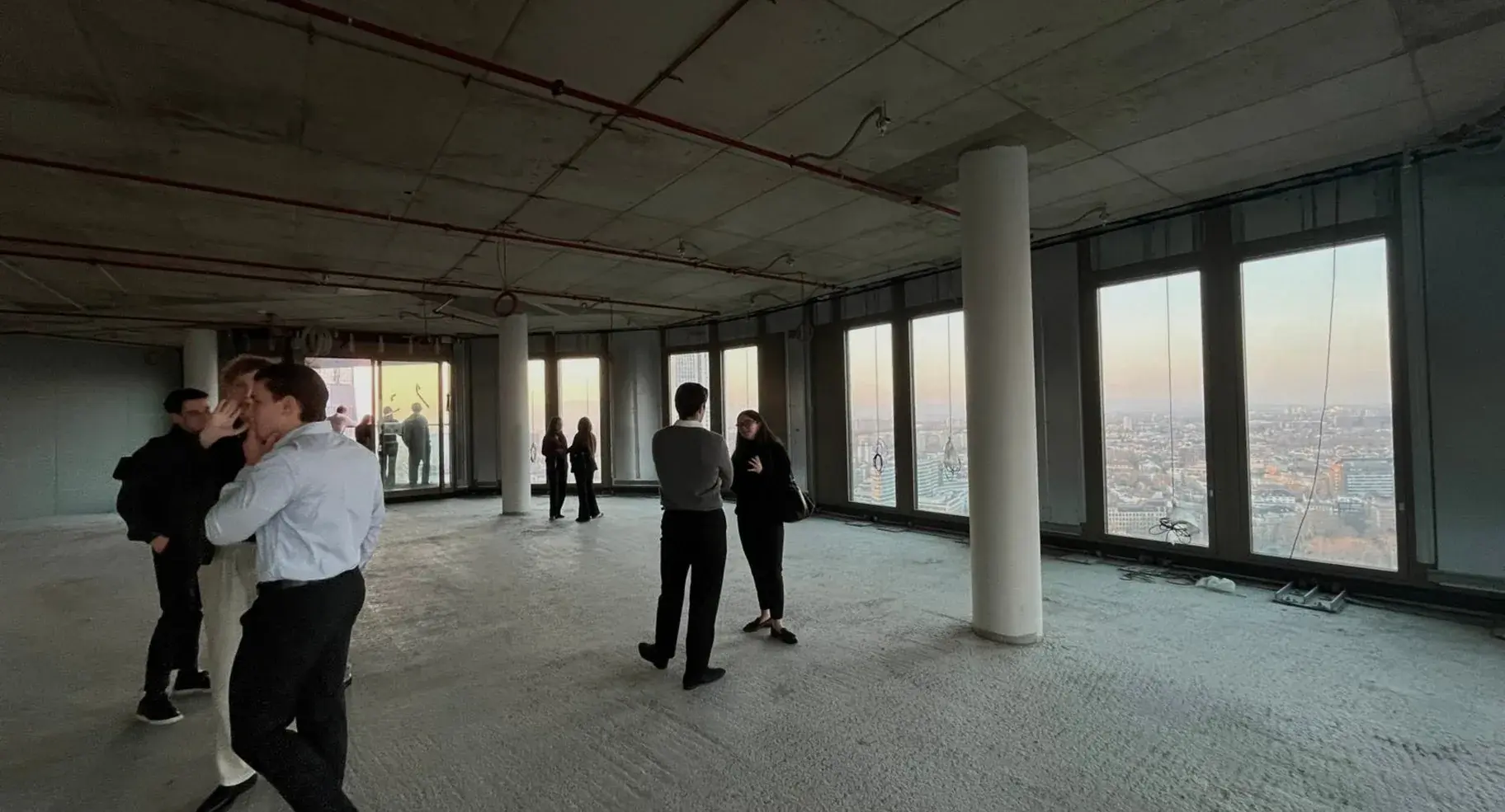 Members touring a project in high-visibility vests