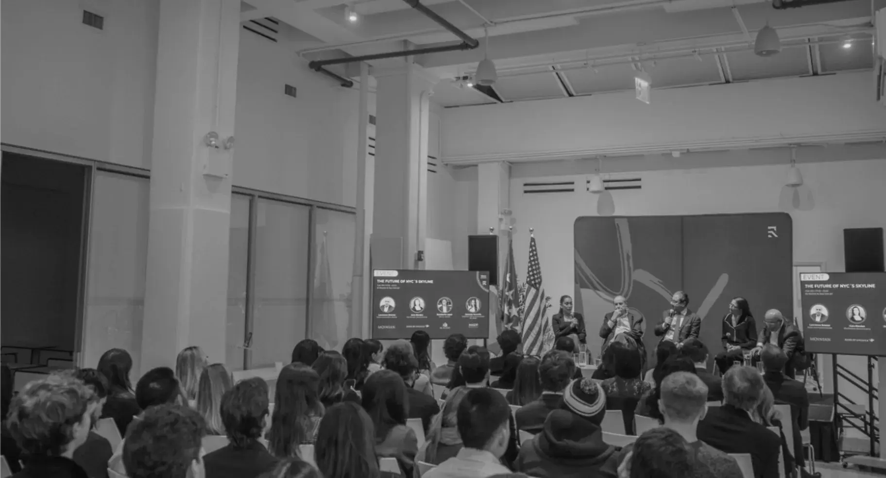 A moderated panel in front of a full audience