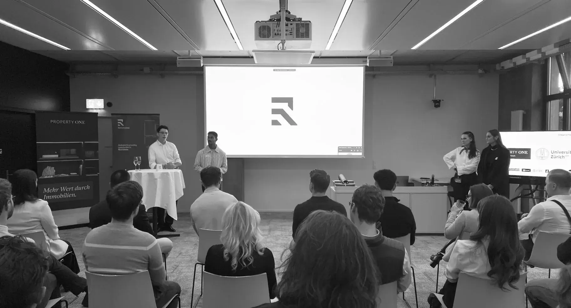 A moderated panel in front of a full audience