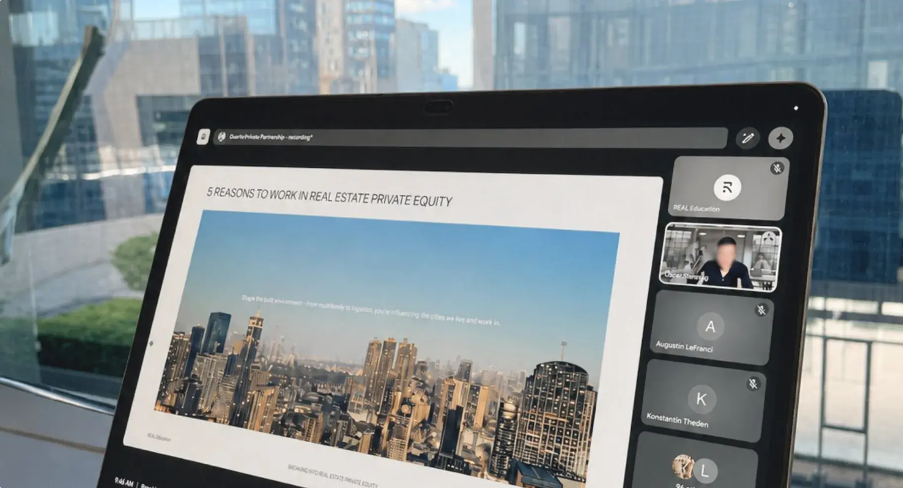 An REA webinar running on a tablet above the city
