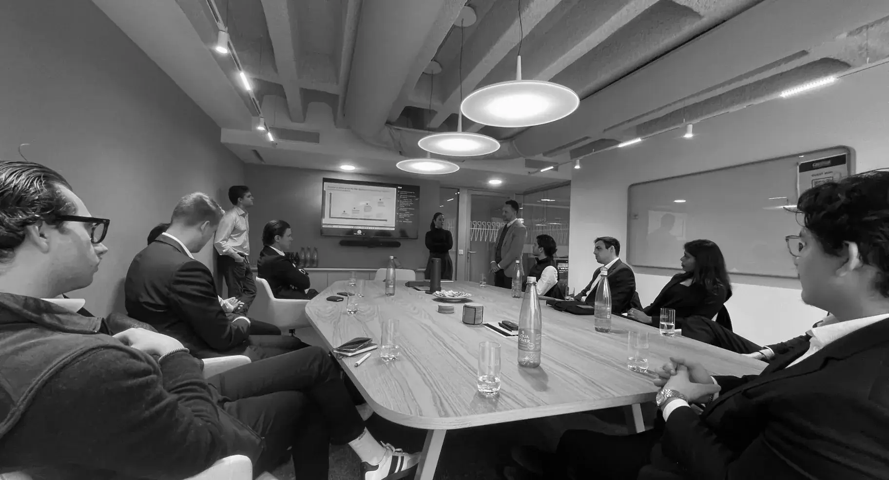 Members around the table with the Greystar team