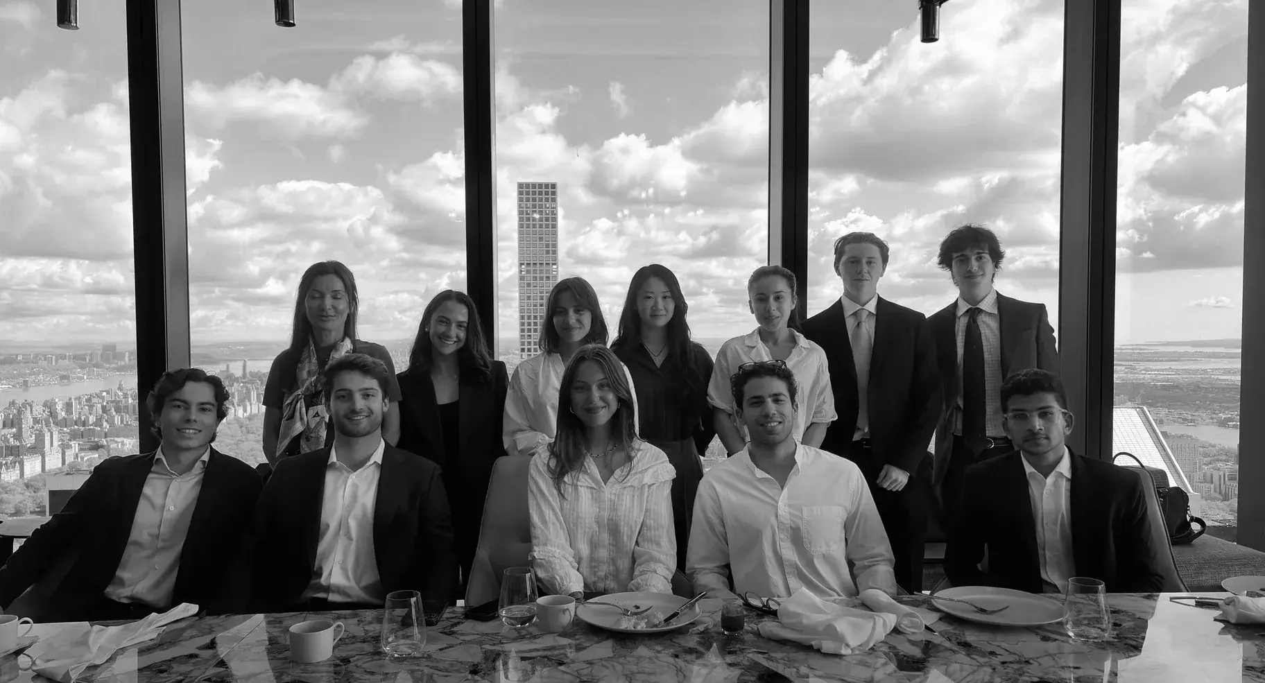 The REA New York group with the Manhattan skyline behind them