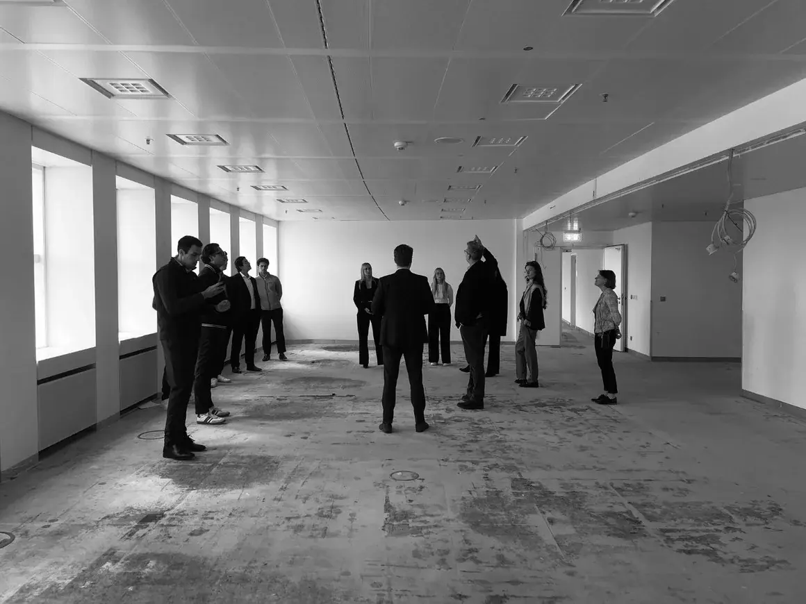 Members touring a bare floorplate in Frankfurt
