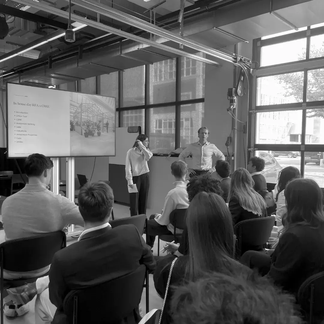 Members seated for a presentation in a firm's office